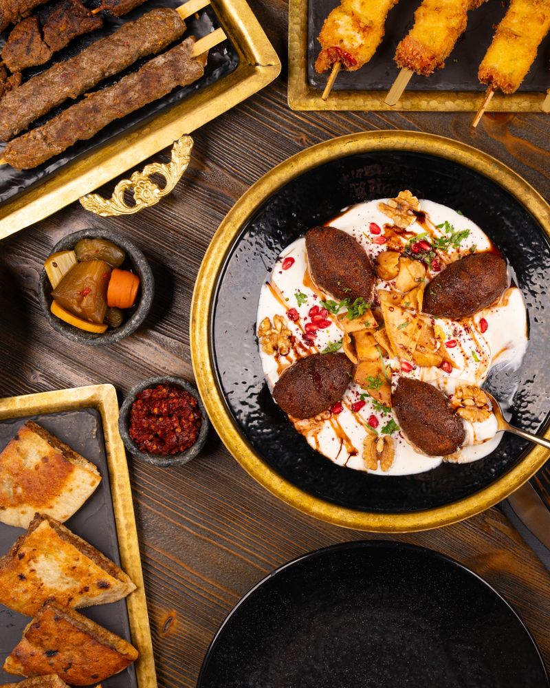 A spread of Middle Eastern mezze with kibbeh, dips and bread