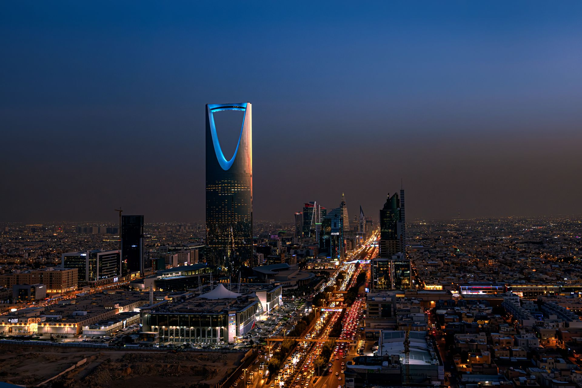 Riyadh at night, seen from above, with the Kingdom Centre tower lit up